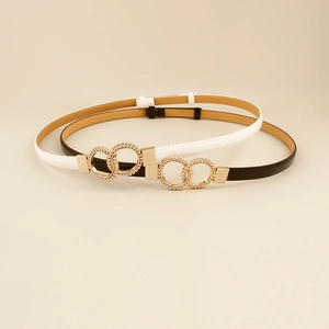 Minimalist black and white slim leather belts with interlocking gold circular buckles