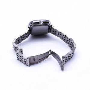 Detailed back view of square quartz watch with silver metal chain strap and folding clasp