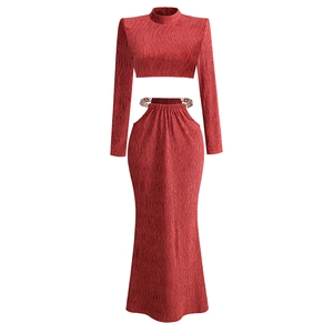 Chic two-piece long sleeve crop top and high waist maxi skirt set with metal chain details