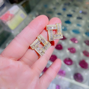 Elegant gold square stud earrings with central cubic zirconia and white pearl border