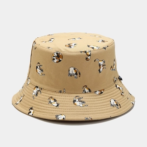Detail view of khaki bucket hat featuring playful calico cat patterns and sturdy stitching