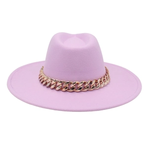 Detail of lavender wide brim fedora hat featuring a chunky gold acrylic chain band
