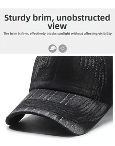 Detail of distressed brim on black washed denim baseball cap showing rugged torn texture