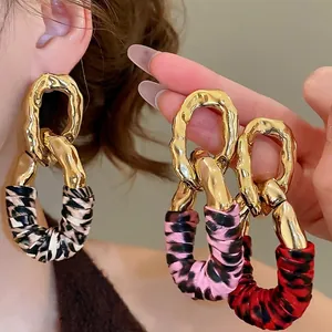 Chic geometric leopard print drop earrings with gold metal links in three vibrant colors