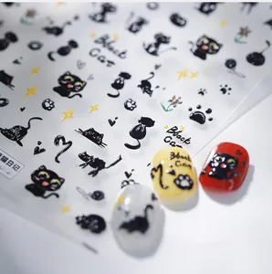 Macro detail of 3D black cat nail stickers showing diverse cat patterns and paw prints