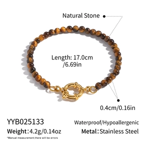 Detailed view of 4mm tiger eye beaded bracelet with gold stainless steel spring clasp