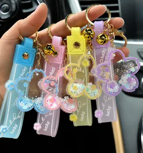 Close-up of colorful quicksand cherry blossom keychains in various colors.