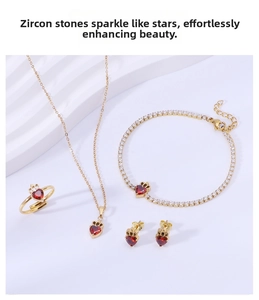 Detailed set of gold titanium steel jewelry featuring red heart zircons and crowns