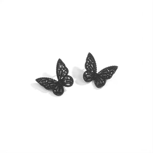Stereoscopic black butterfly earrings with cubic zirconia inlay on white background