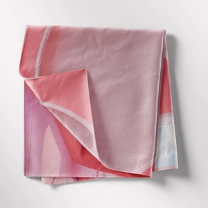 Close-up of bohemian fabric showing detailed mesh texture and soft pink wavy patterns