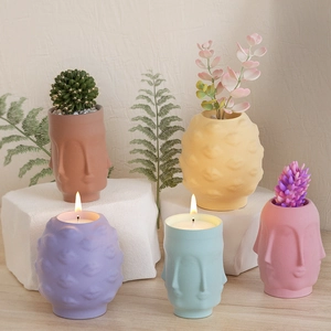 Creatieve keramische plantenbakken en kaashouders met gezichten in vijf matte kleuren