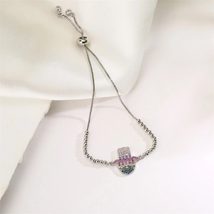 Detailed shot of silver Hamsa Hand bracelet with colorful gradient cubic zirconia stones