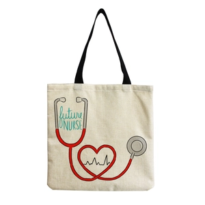 Close-up of canvas texture and future NURSE print with stethoscope heart on a tote bag
