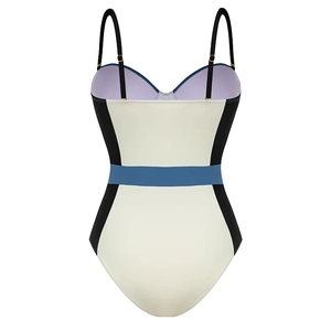 Back view of a color-block one-piece swimsuit with ivory, black, and blue panels