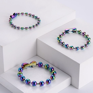 Rainbow-plated stainless steel bead chain necklace and bracelet set on white display