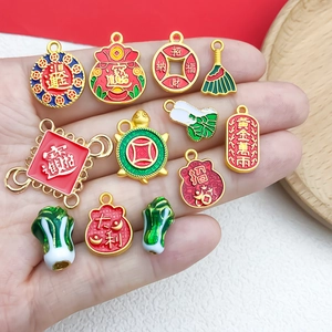 Handheld display of traditional Chinese gold and red DIY lucky charms and pendants