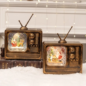 Retro TV Christmas music box with Santa and reindeer scene featuring glowing snow globe effect