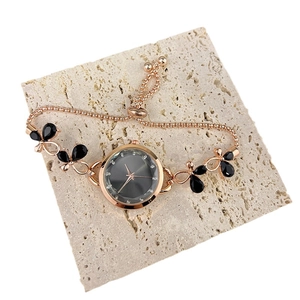 Rose gold chain watch for women featuring butterfly accents and a grey round dial