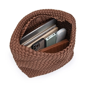 Brown hand-woven large capacity tote bag showing spacious interior with laptop and essentials