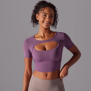 Close-up of purple short sleeve yoga top featuring hollow-out chest detail and mesh splicing