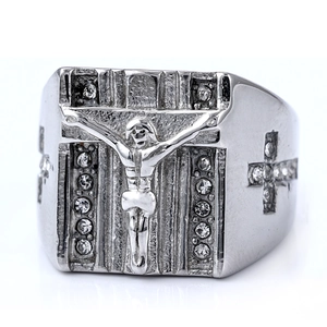 Detail shot of a wide stainless steel ring with Jesus crucifix and sparkling zircons