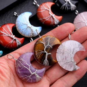 Handmade wire wrapped crescent moon pendant with natural crystals and tree of life design