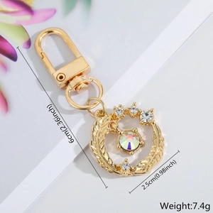 Detailed view showing the 6cm length and 2.5cm diameter of the crystal evil eye keychain