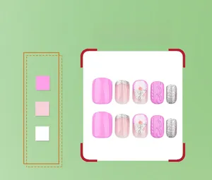 Detailed view of silver glitter and pink embossed 3D Christmas press-on nail set