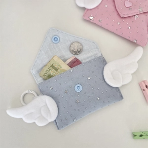 Detail showing coin storage in cute angel wing envelope mini wallets with plush wings