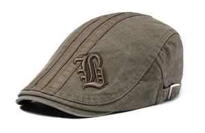 Detail of army green cotton beret featuring gothic B embroidery and metal adjustment buckle
