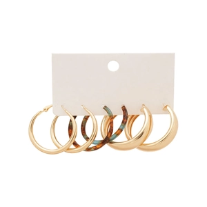 Three-pair gold metal and tortoiseshell resin hoop earrings set on white display card