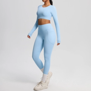 Detail view of high-waist yoga leggings with side pockets and matching crop top