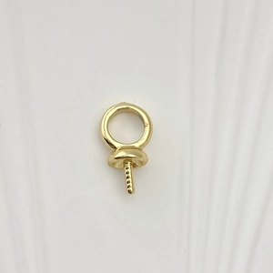 Macro detail of an 18K gold-plated screw eye pin bail for DIY jewelry pendants