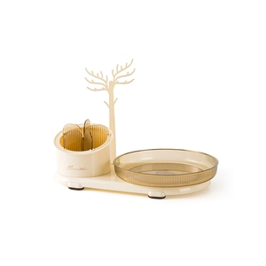Rotating beige cosmetic organizer with deer antler jewelry rack and amber trays