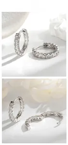 Detail view of S925 silver hoop earrings with clear zircon stones and leaf hinge mechanism