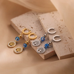 Gold and silver tree of life earrings with evil eye beads on textured stone base