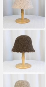 Close-up of knit bucket hats in beige and brown showing fluffy mohair texture and crochet weave