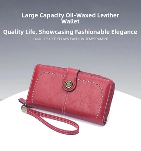 Detail view of red oil wax leather long wallet with zipper and vintage buckle strap