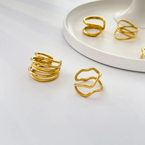 Minimalist gold-plated stainless steel rings with layered wavy twisted band designs