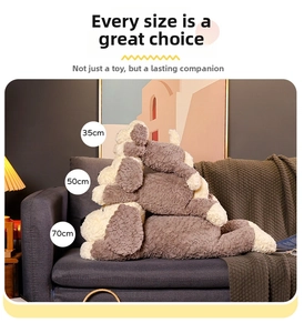 Three sizes of plush brown stuffed dogs on a cozy gray sofa, measuring 35cm, 50cm, and 70cm