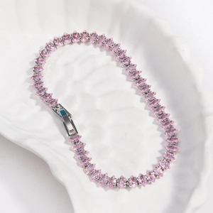 Detail of pink marquise-cut zircon stones set in a silver-plated tennis bracelet