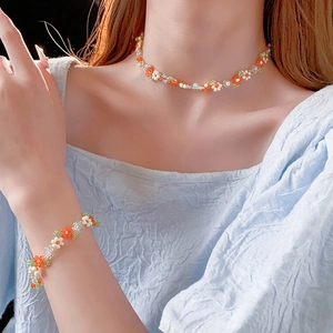 Handmade floral beaded necklace and bracelet set in fresh white, orange and green colors