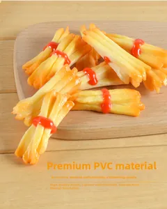 Realistic PVC french fries model with red sauce accent on a wooden cutting board