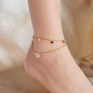 Double-layered gold butterfly anklet with a blue faux-mother-of-pearl pendant
