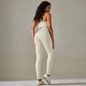 Detail view of seamless yoga set with high waist leggings and cross back sports bra