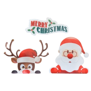 Macro detail of reflective honeycomb texture on Santa and Reindeer magnetic car decals