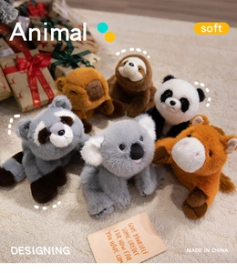 Plush animal toy set with panda, capybara and koala in a cozy festive gift setting