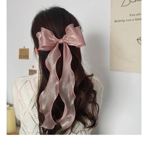 Elegant large pearlescent pink bow hair clip with organza texture for a Lolita style