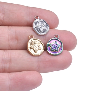 Detailed macro of 18k gold plated starfish charms for DIY jewelry in three colors