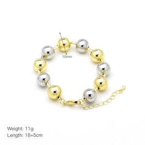 Detail view of 10mm gold and silver polished metal bead bracelet with lobster clasp